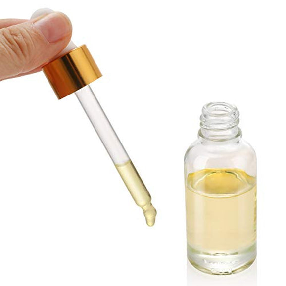 Black Widow Hair Growth Oil. Glass dropper bottle with gold cap and clear liquid on a white background