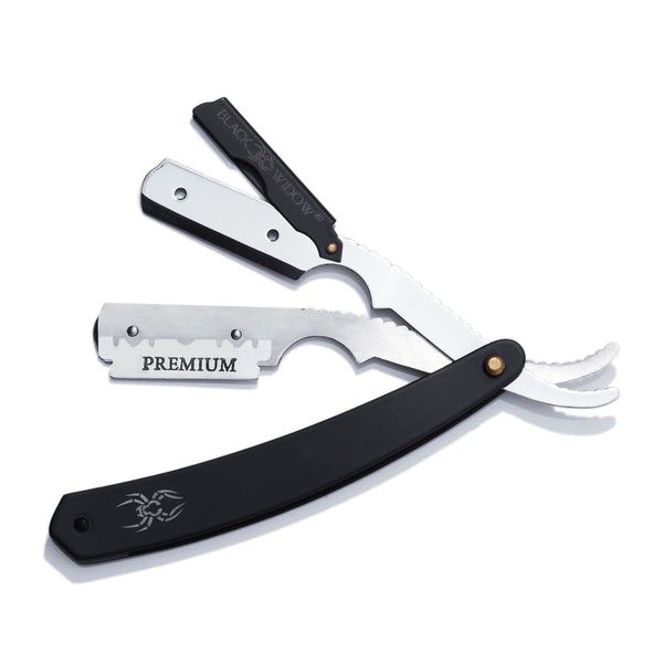 A straight blade razor with black handle and silver blade, accompanied by additional blade caps. The handle features the Black Widow logo.